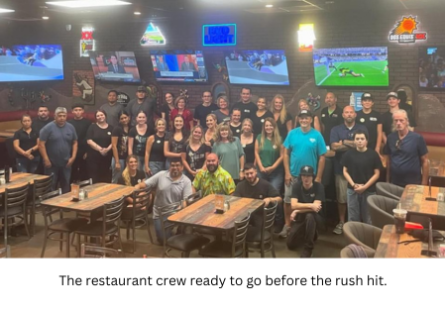 The restaurant crew ready to go before the rush hit.